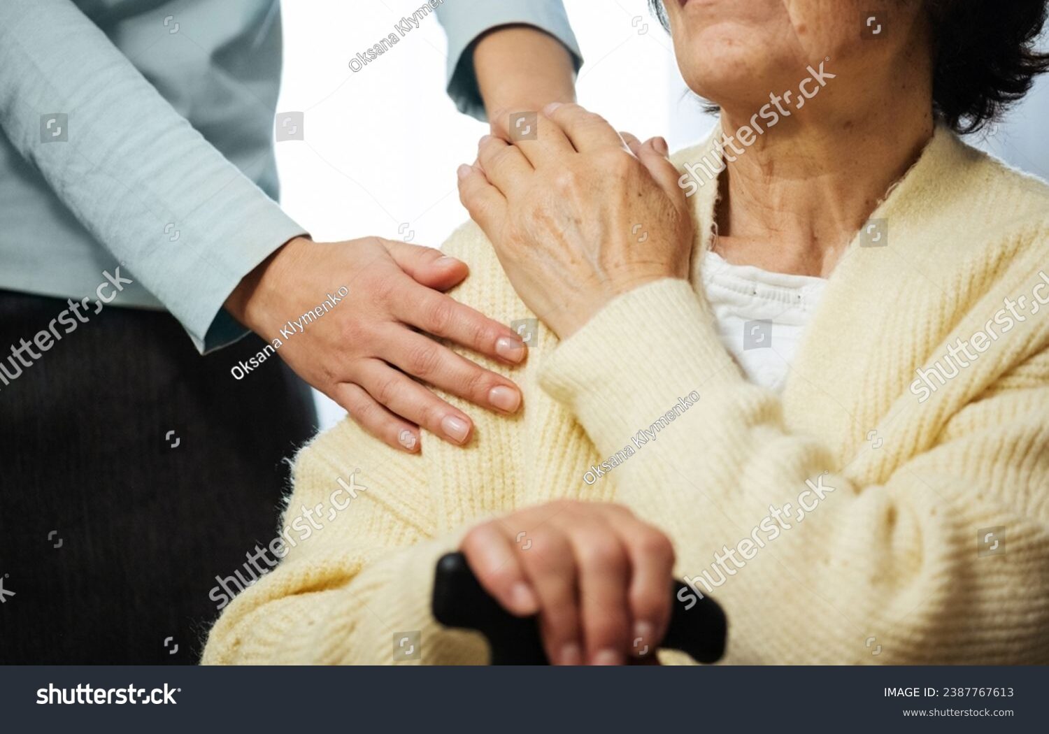 stock-photo-mature-female-in-elderly-care-facility-gets-help-from-hospital-personnel-nurse-senior-woman-with-2387767613